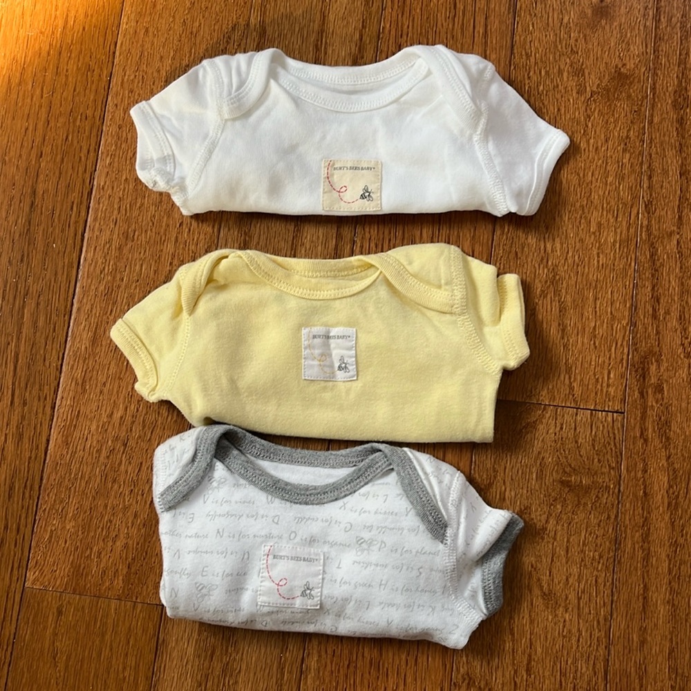 Set of three Burt’s bees baby onesies